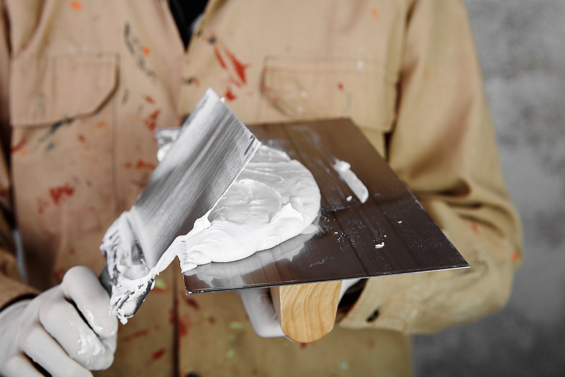 Plasterer with plastering tools